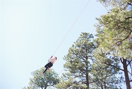 Somone ziplining at Flagstaff Extreme Adventure Course