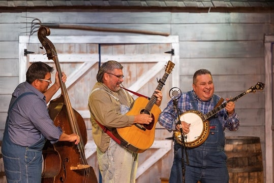 Goldwing Express performers with their banjo & guitars at the 	Playhouse Theatre in Shepherd of the Hills, Branson, Missouri