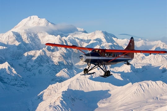 A wide view of the plane flying over Otter Mountain in Talkeetna, Alaska.