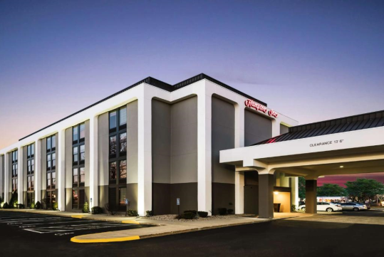 Hotel exterior at night.