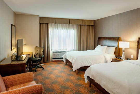2 Queen-sized luxurious Suite Dreams® by Serta bed at Hilton Garden Inn Seattle Downtown.