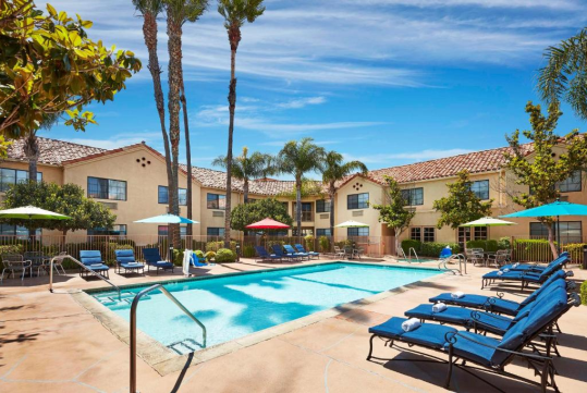 Refreshing outdoor pool with sun loungers.