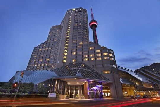 View of the hotel exterior and the iconic CN tower.
