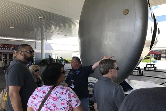 People looking at one of the return shuttles on the Kennedy Space Center Small Group VIP Experience with Transportation from Orlando Area. Orlando, Florida