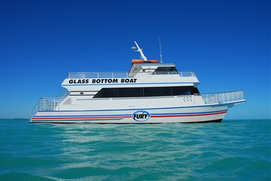 Glass bottom boat sailing to the coral reef during the Key West Glass Bottom Boat Tour in Key West, Florida.