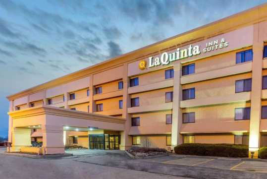 Exterior view and main entrance of the hotel at night.