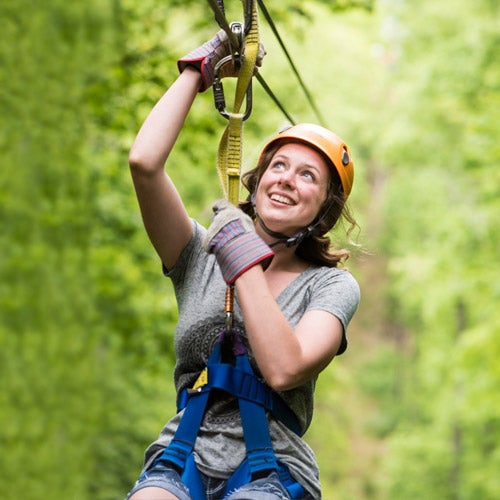 Soar through the air with Legacy Mountain Premier Ziplines.