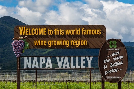 A sign welcoming guests to the world famous wine growing region of Napa Valley