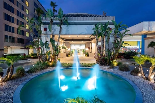 Hotel entrance with a water fountain.