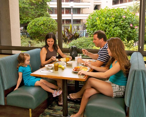 A family dining at Rosen Inn at Pointe Orlando in Orlando, Florida.