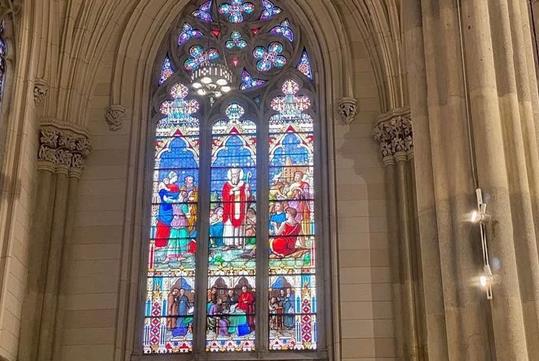 A beautiful and intricate stained glass window in St. Patrick's Cathedral on the Official Self-Guided Audio Tour.