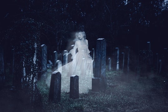 Ghostly figure in cemetery at Dead of Night Ghost Tour in Williamsburg, VA