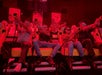 Riders in full-motion seats with blasters in the 7D Experience San Francisco thrill ride.