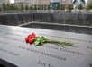 A flower on a memorial plaque on the 9/11 Memorial Tour & Priority Entrance 9/11 Museum Tickets Tour in New York City, New York, USA.