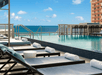 Outdoor pool and sun loungers at AC Hotel by Marriott Miami Beach, FL.