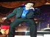 Travis James as Conway Twitty singing in a blue & black suit at A Tribute to Conway Twitty by Travis James at the Tribute Theater in Pigeon Forge, Tennessee