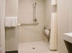 Guest bathroom with a walk-in/roll-in shower.