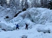 Guide and guest show off icicle formations.