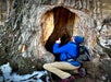Guide shows the details of the inside of a large tree in Chugach State Park.