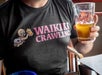 Guest holds a beer from a local pub