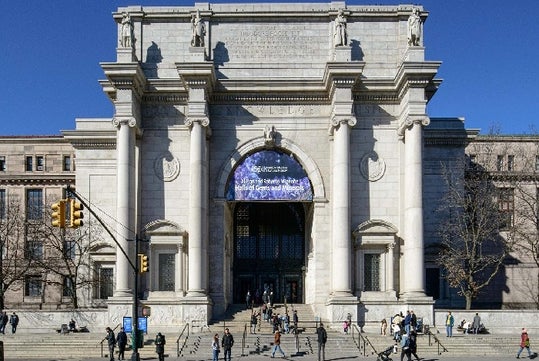 The exterior of the American Museum of Natural History on a sunny day in NYC, New York.
