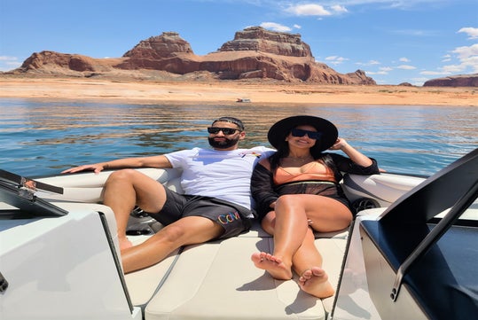 Couple enjoying a private boating excursion at Antelope Canyon