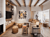 Living space with a fire pit, flat-screen TV, and soft seating inside a suite.