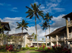 Beautiful landscaped hotel exterior surrounded with trees.
