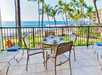 Private balcony with ocean view and seating area.