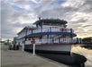View looking up at the front Barefoot Queen Riverboat Cruise parked at the dock at sunset in North Myrtle Beach.