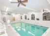 Indoor pool with loungers.