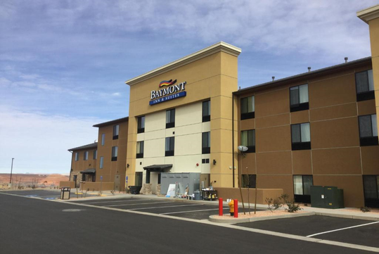 Hotel exterior and parking area.
