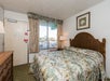 One king bed inside a guest room.