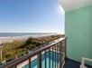View of the beach and pool area from the balcony.