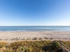 Oceanfront view from a guest room balcony.