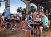 Families enjoy a meal at the oceanfront Town Center.