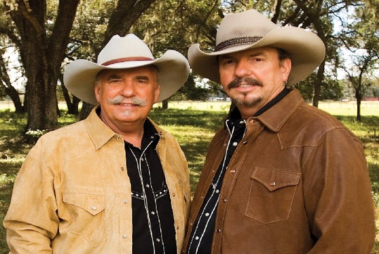 Bellamy Brothers in brown jackets and cowboy hats