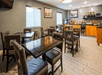 Breakfast area with modern furniture, and a selection of breakfast items.