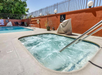 Refreshing outdoor pool with a soothing tub.