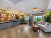 Lobby with soft seating, ATM, and stylish front desk.