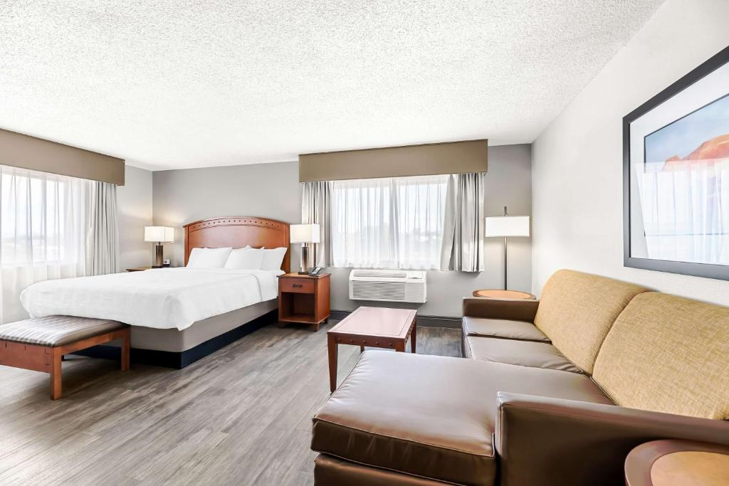 Relax in a well-appointed room with a king bed and a comfortable sofa.