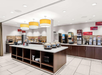 The breakfast buffet stations include hot and cold items, juices, breads, and more.
