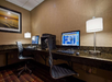 Business center with two computers and a printer.