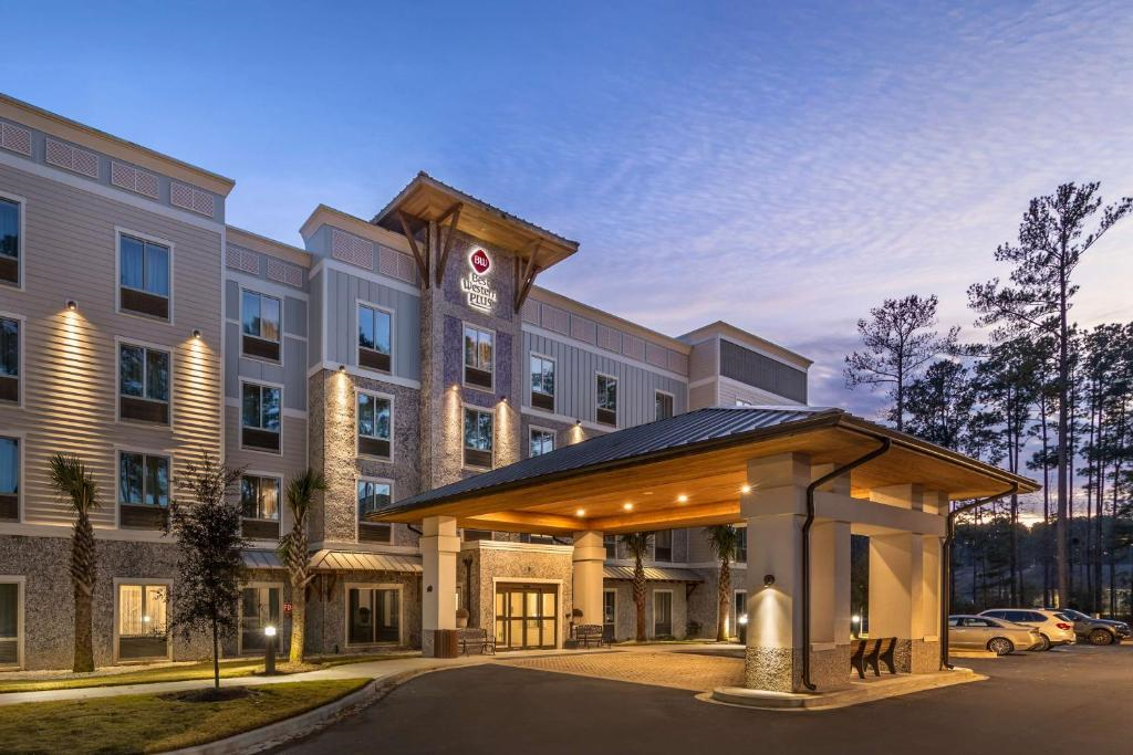 Hotel exterior at dusk.