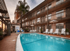Outdoor pool and sun loungers.