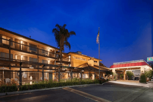 Hotel exterior at night.