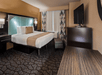One king bed inside a guest room.