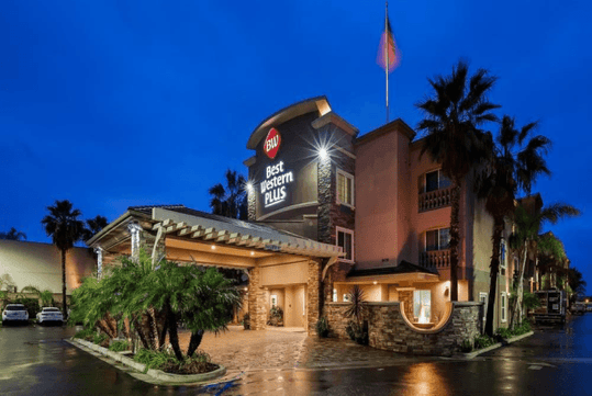 Hotel exterior at night.