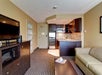 Living area, sofa bed, kitchenette, flat-screen TV  at Best Western Plus Toronto North York Hotel & Suites, ON.