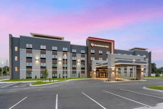 Hotel exterior with parking space.